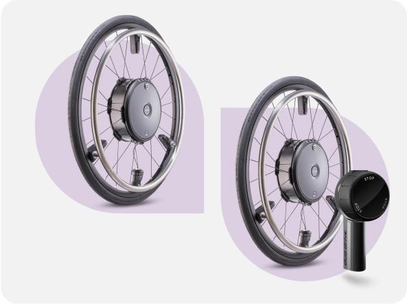Zwei e-motion Antriebsräder, eines davon mit anthrazitfarbener Bedieneinheit